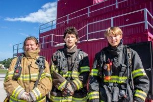 Three students in fire gear