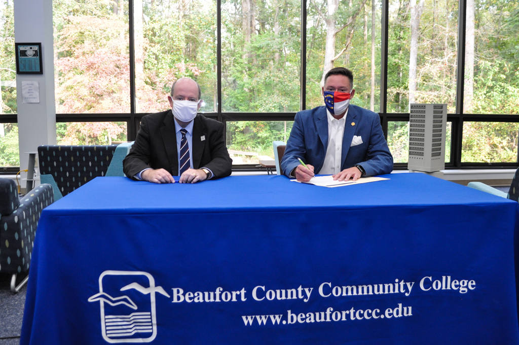 two people and a table cloth with Beaufort County Community College