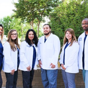 A group of students in white coats.