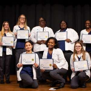 Group of women holding certificates