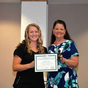 2 women holding certificate