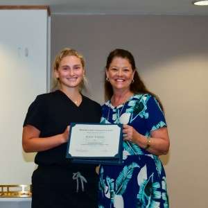 2 women smiling & holding certificate