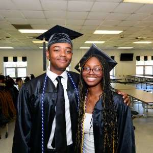 2 people in cap & gown