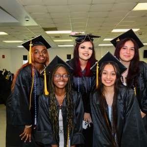 5 people in cap & gown