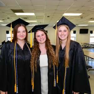 3 girls in cap & gown