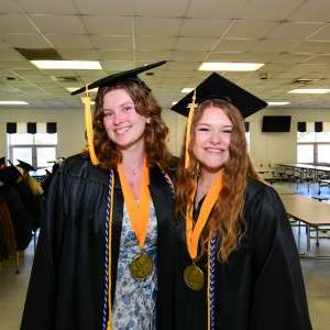 2 girls in cap & gown