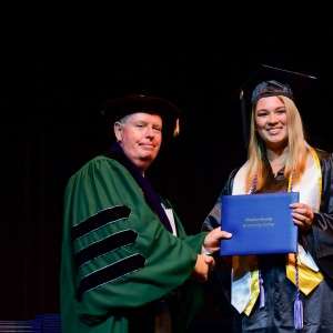 man & woman with diploma