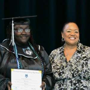 2 women with a certificate