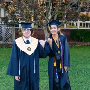 2 people in cap & gown
