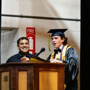 2 people at podium