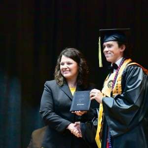 @ people on stage with a diploma