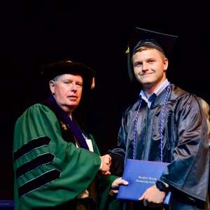 2 men with diploma