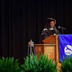 Woman at podium speaking