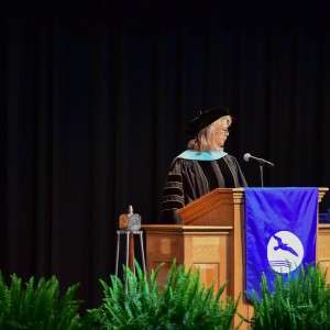 woman speaking at podium