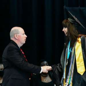Shaking hands on a stage