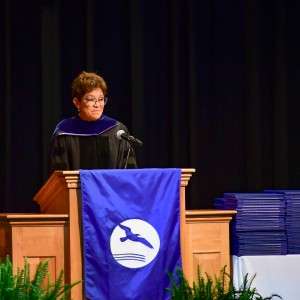 Woman speaking on stage