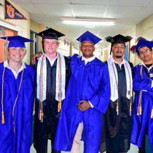 Group of pople with academic ribbons