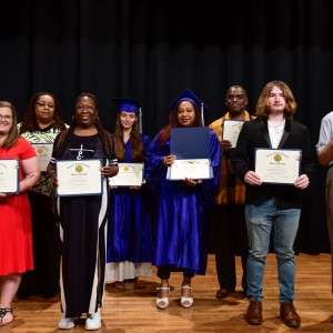 Group holding their GED's