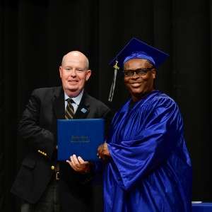 2 men with a diploma