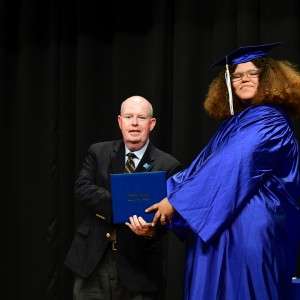 Man holding a diploma