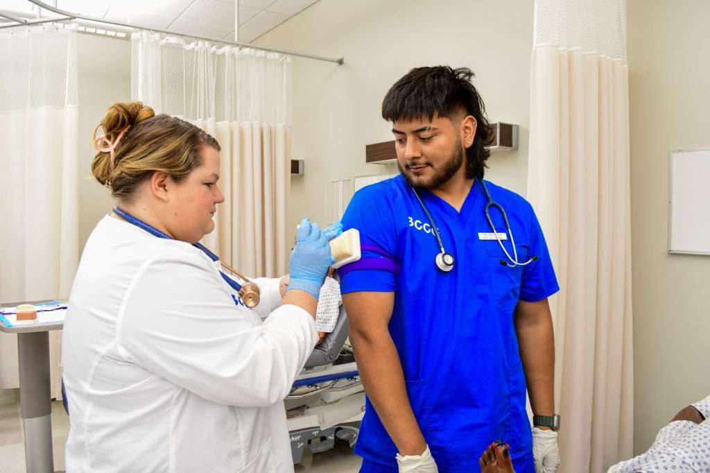 Female and male nursing students in a nursing lab