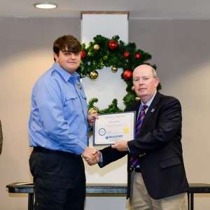 2 men holding certificates