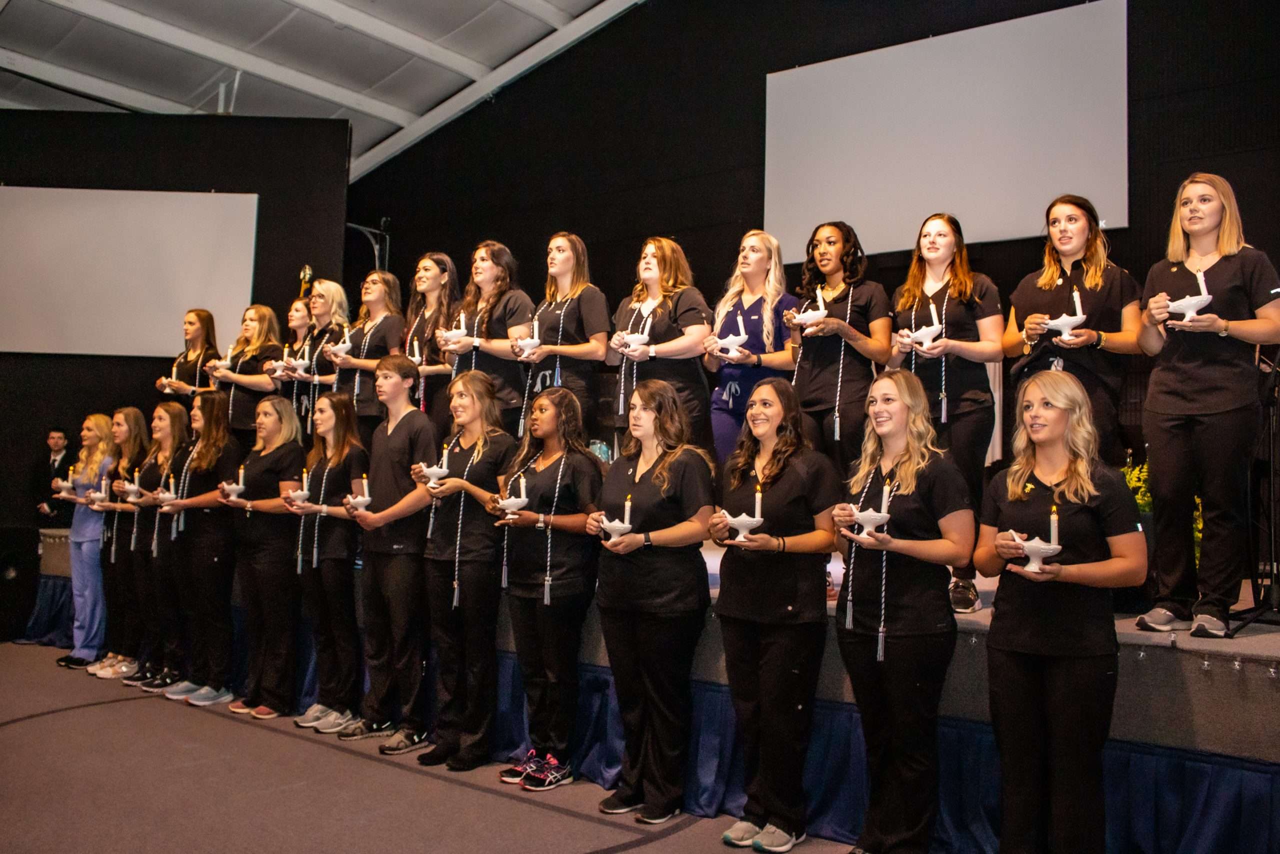 large group of nursing graduates at ceremony