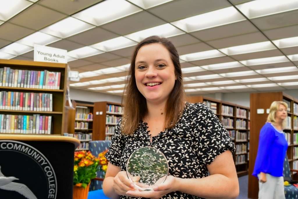 Woman standing with award