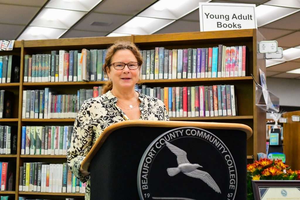 Woman speaking behind podium