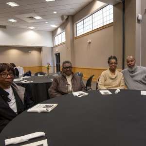 4 poeople at a table