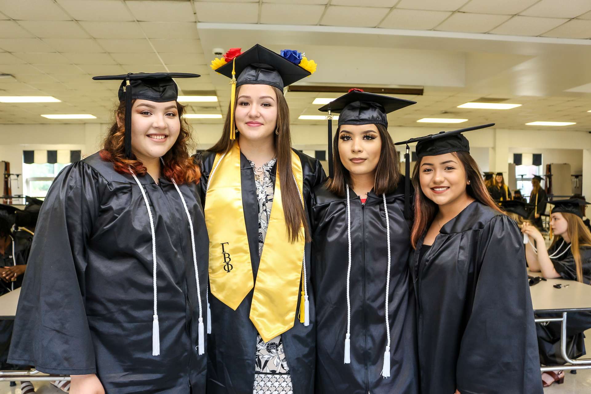 four people at graduation