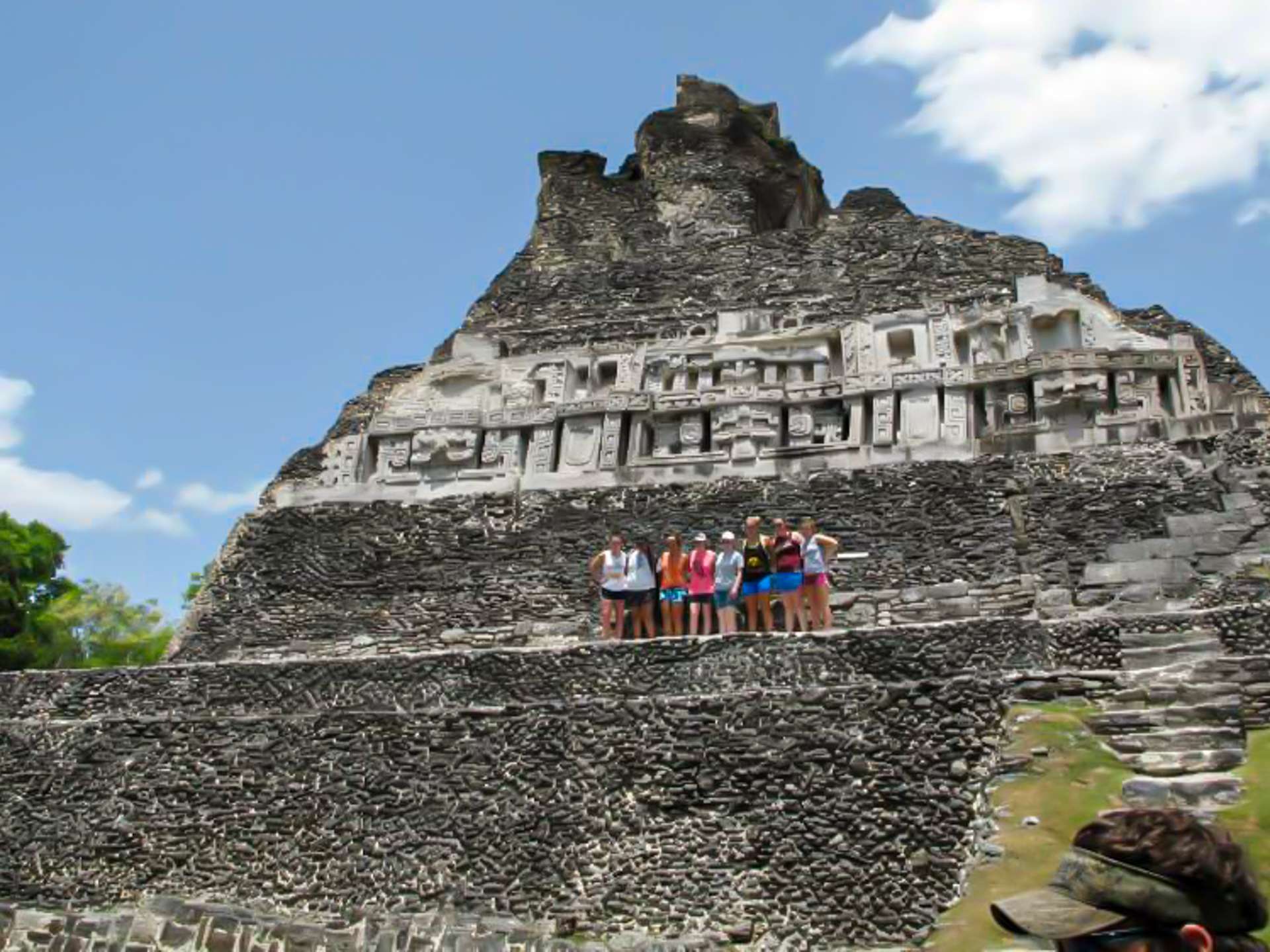 a group in front of ruins