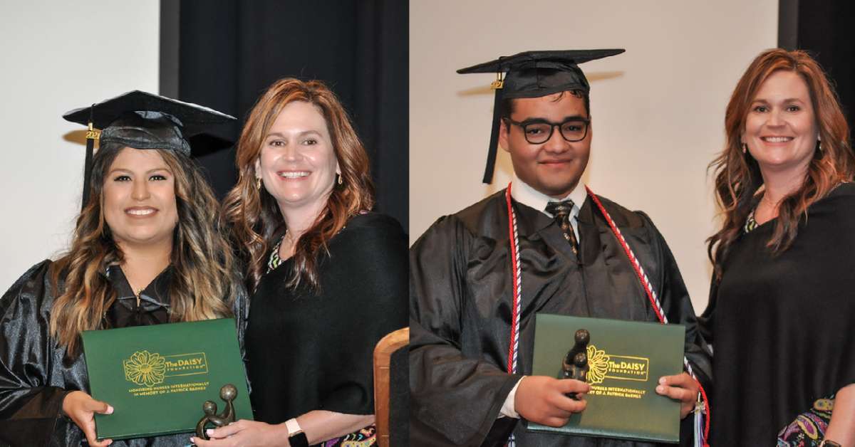 Two people with awards