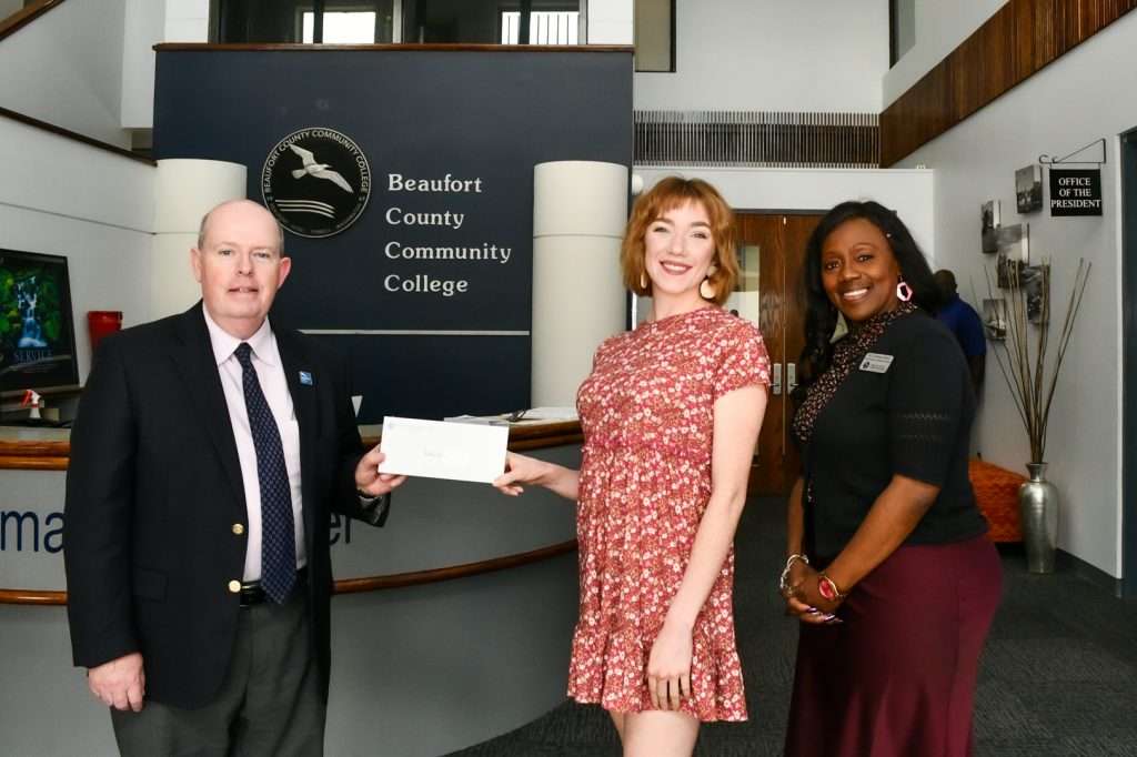 Student receiving award.