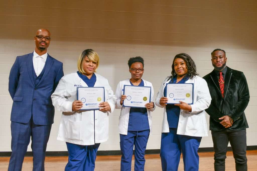 3 people with certificates