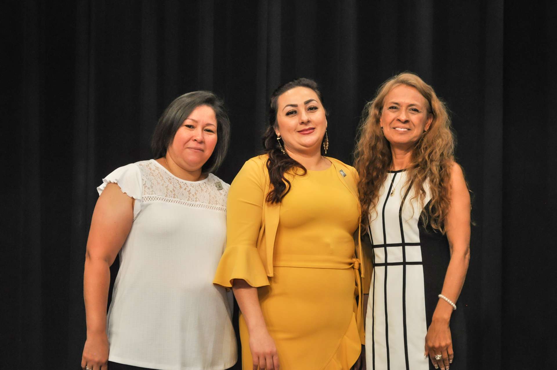 3 people on stage