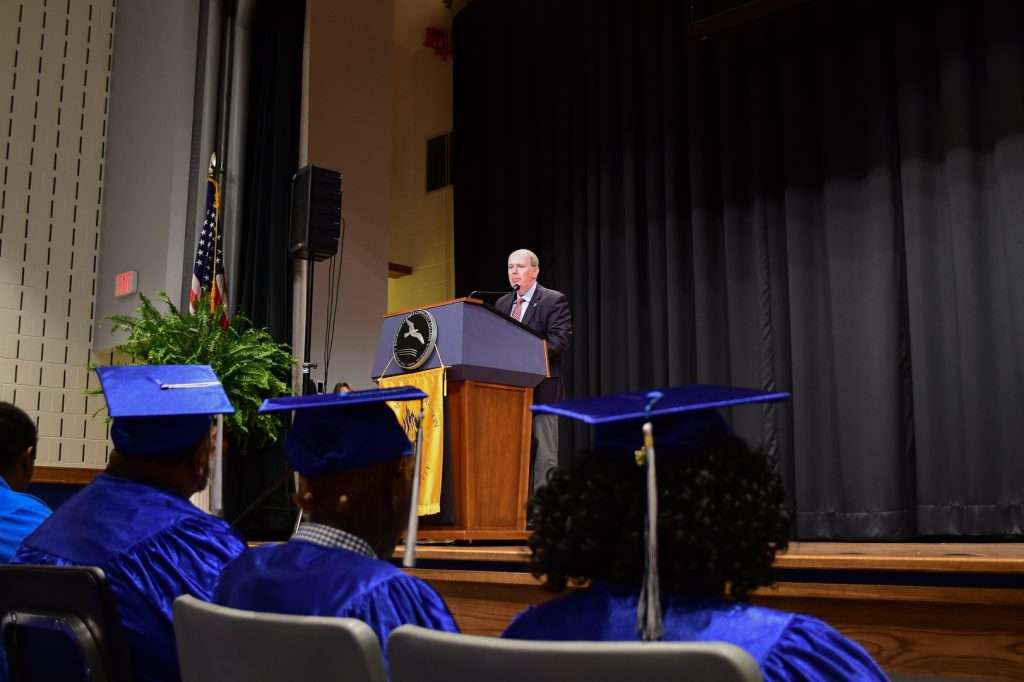 Man speaking at podium