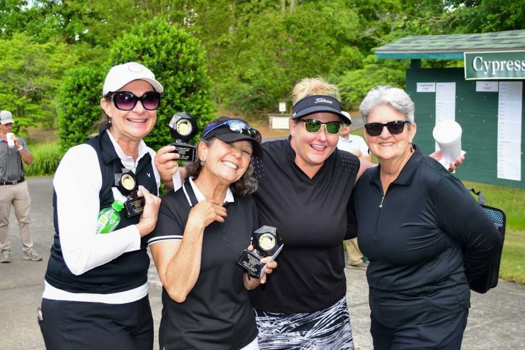 4 women golfers having fun