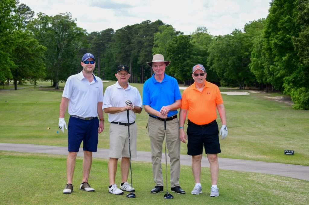 4 person golf team om course