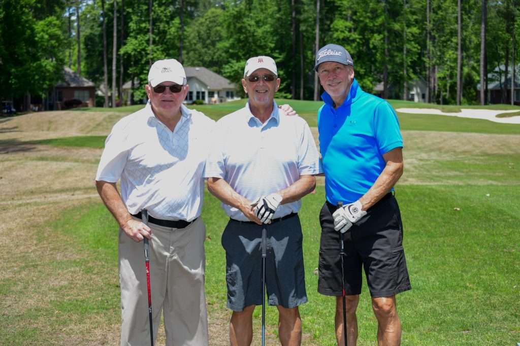 3 people on golf course