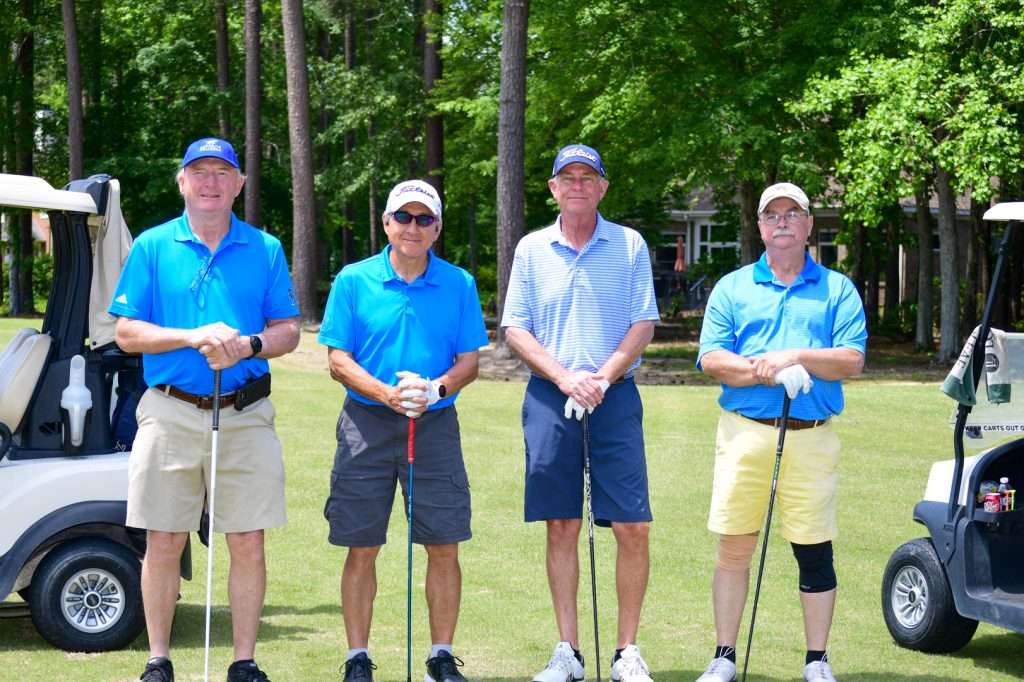 4 person team on golf course