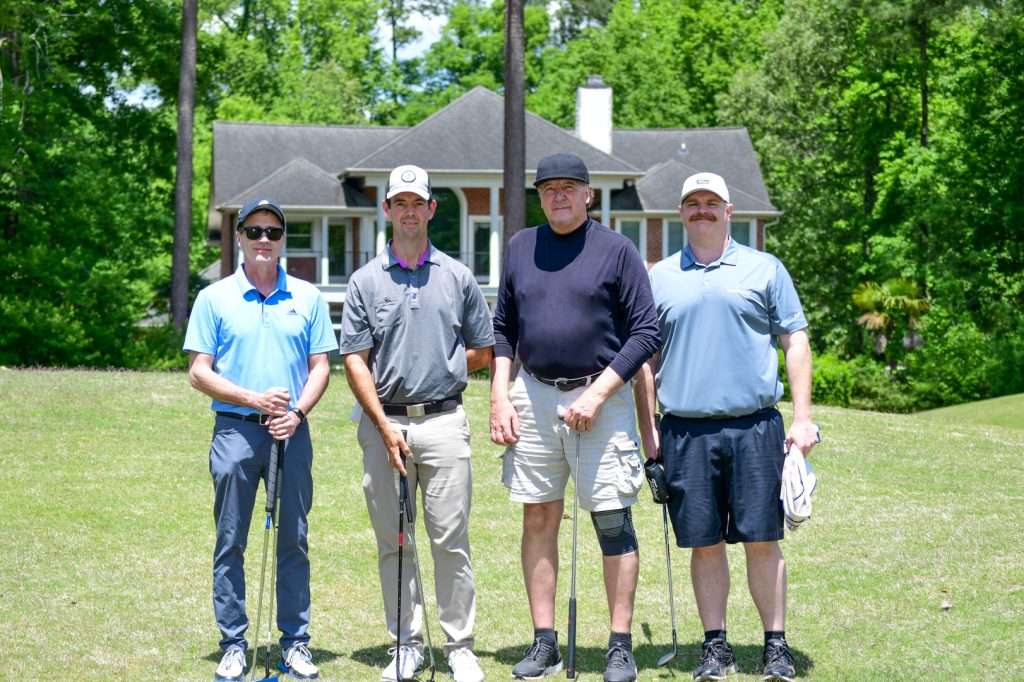 4 people on golf course
