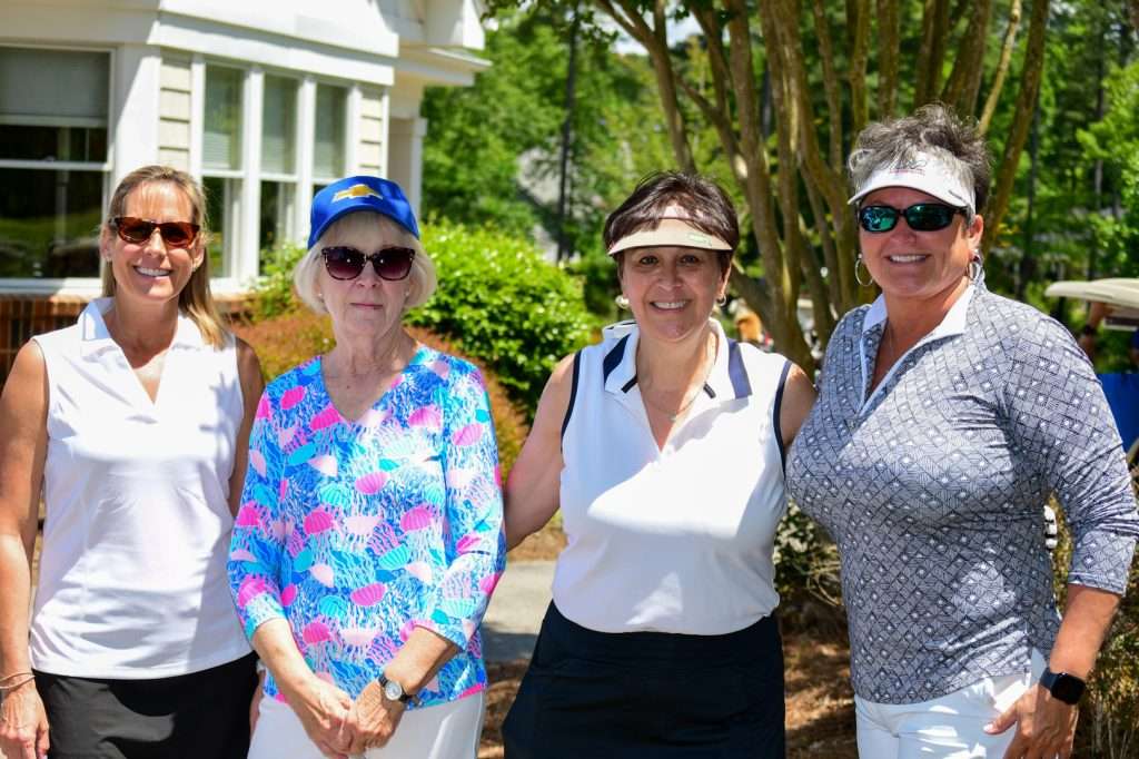 4 women in golf attire
