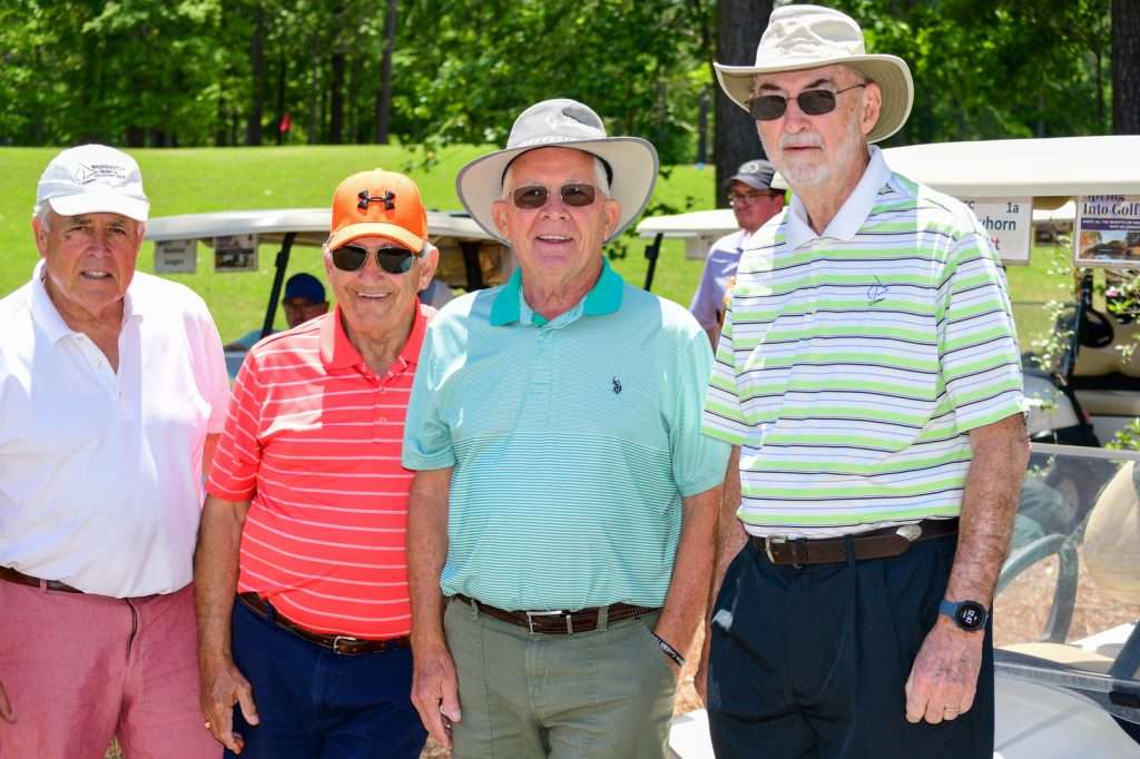 $ people in golf attire
