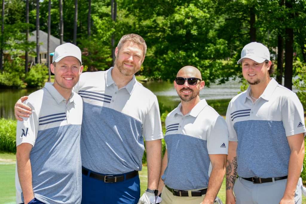 4 male golfers