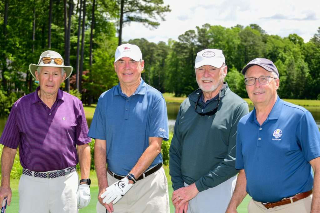 4 men golfers