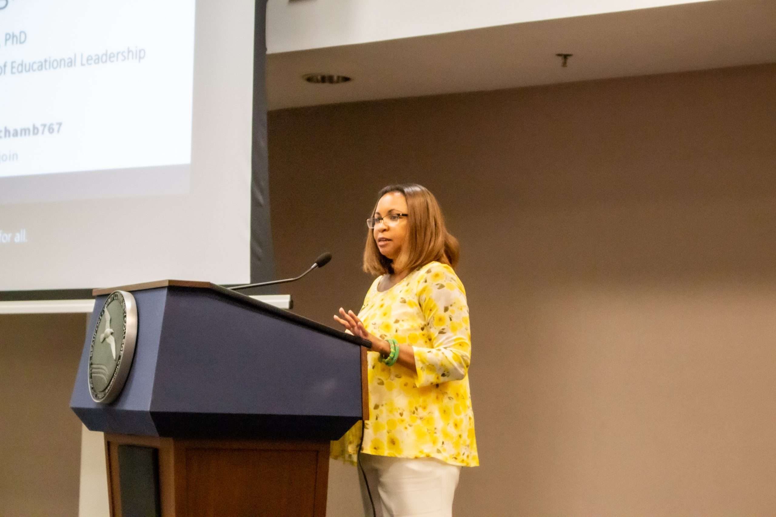 person speaking at a podium