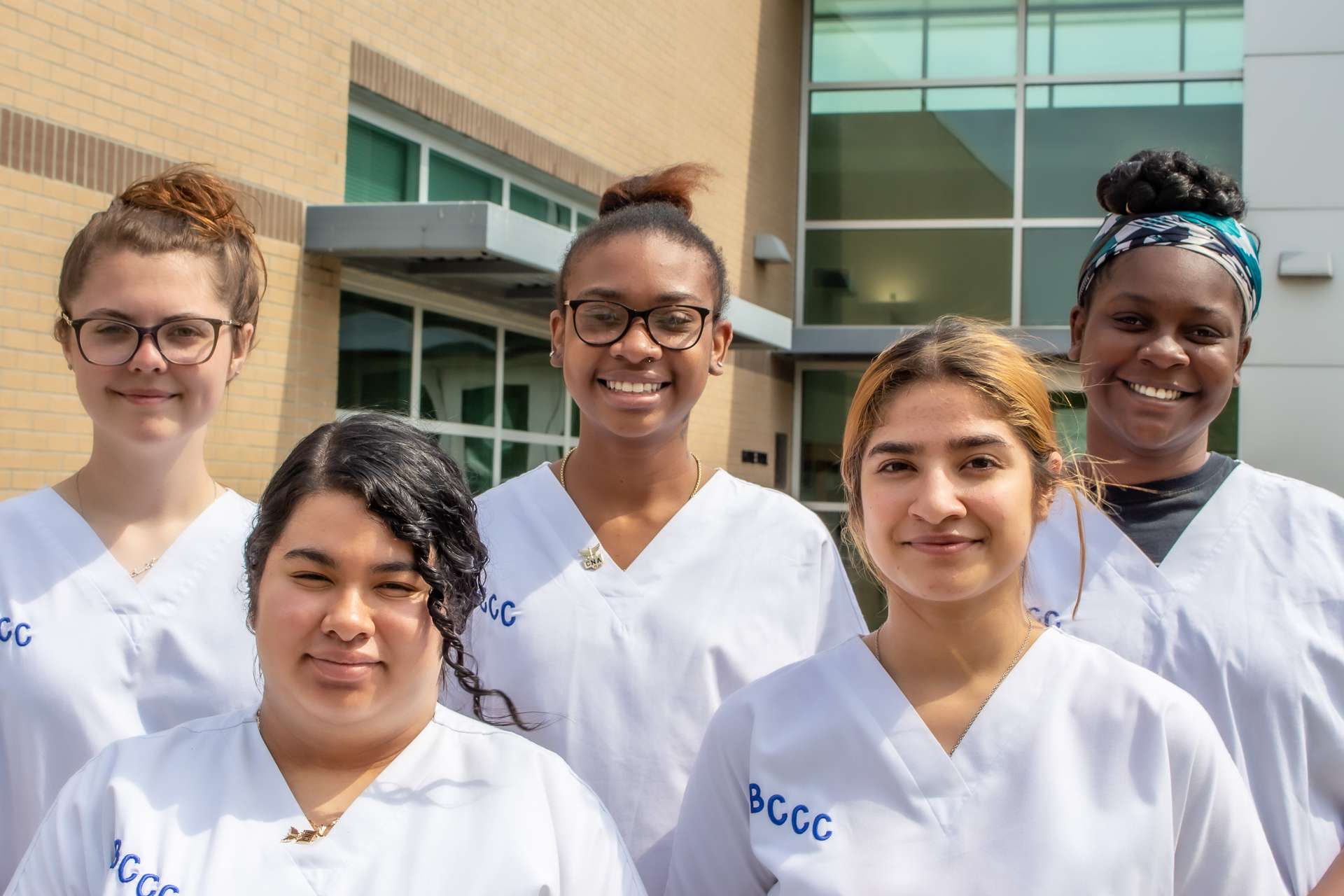five students in white