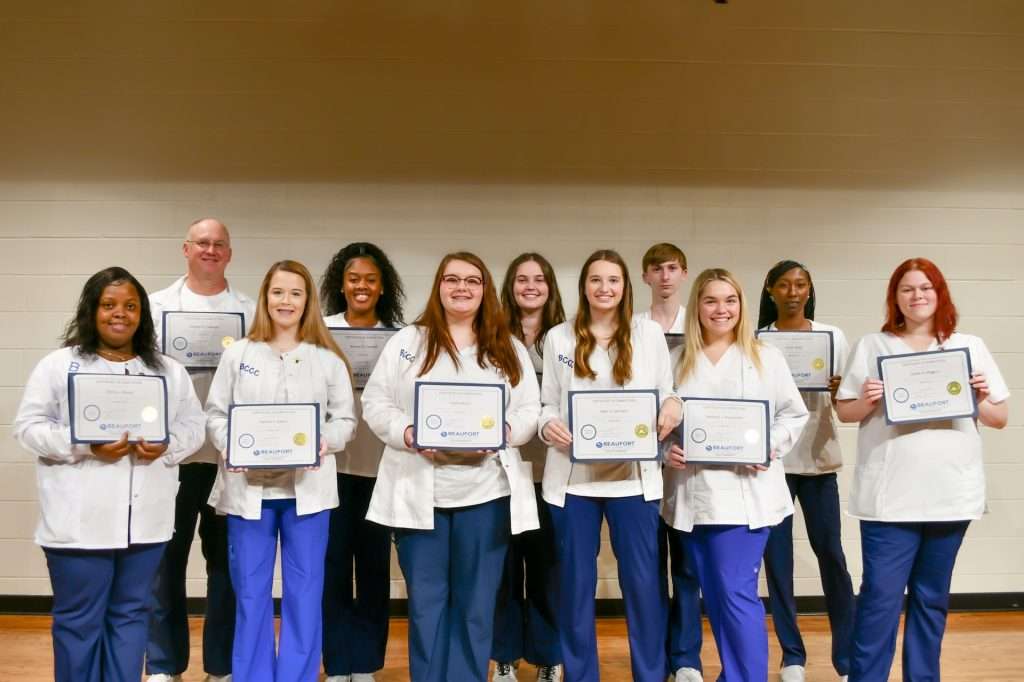 A group of people with certificates