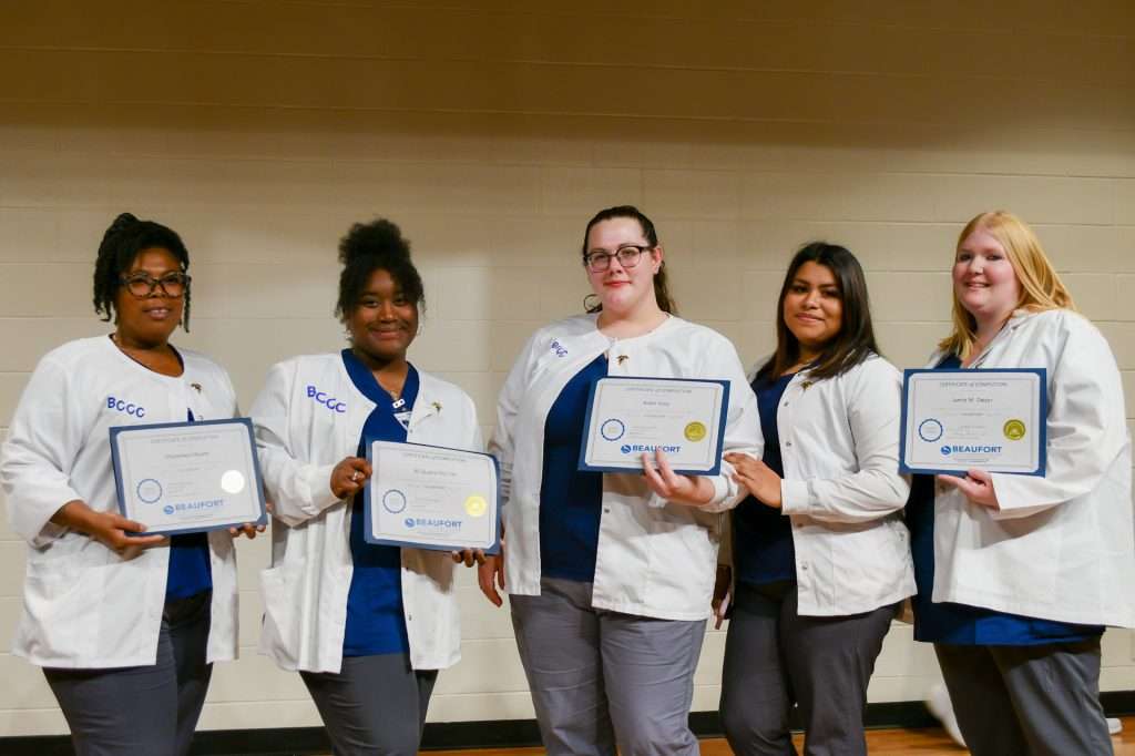 5 people with certificates